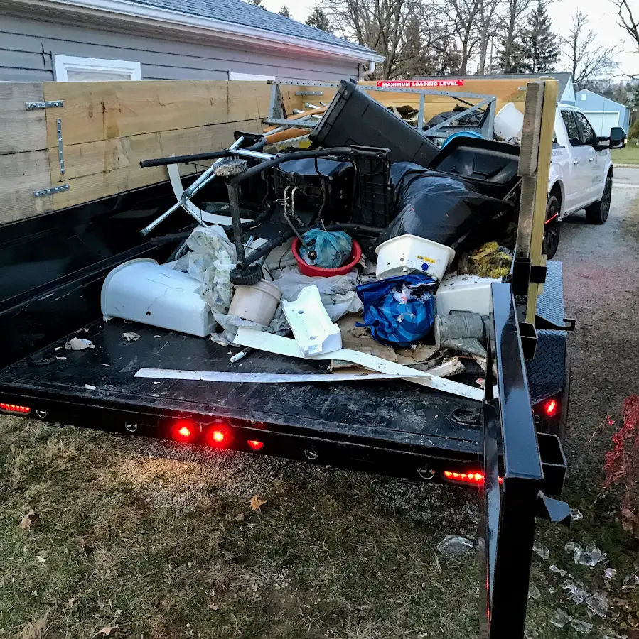 Roll-off dumpster delivered to a residential driveway in Surf City