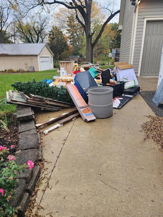 Dumpster being loaded with debris for 3 Yard Dumpster Rental in Surf City